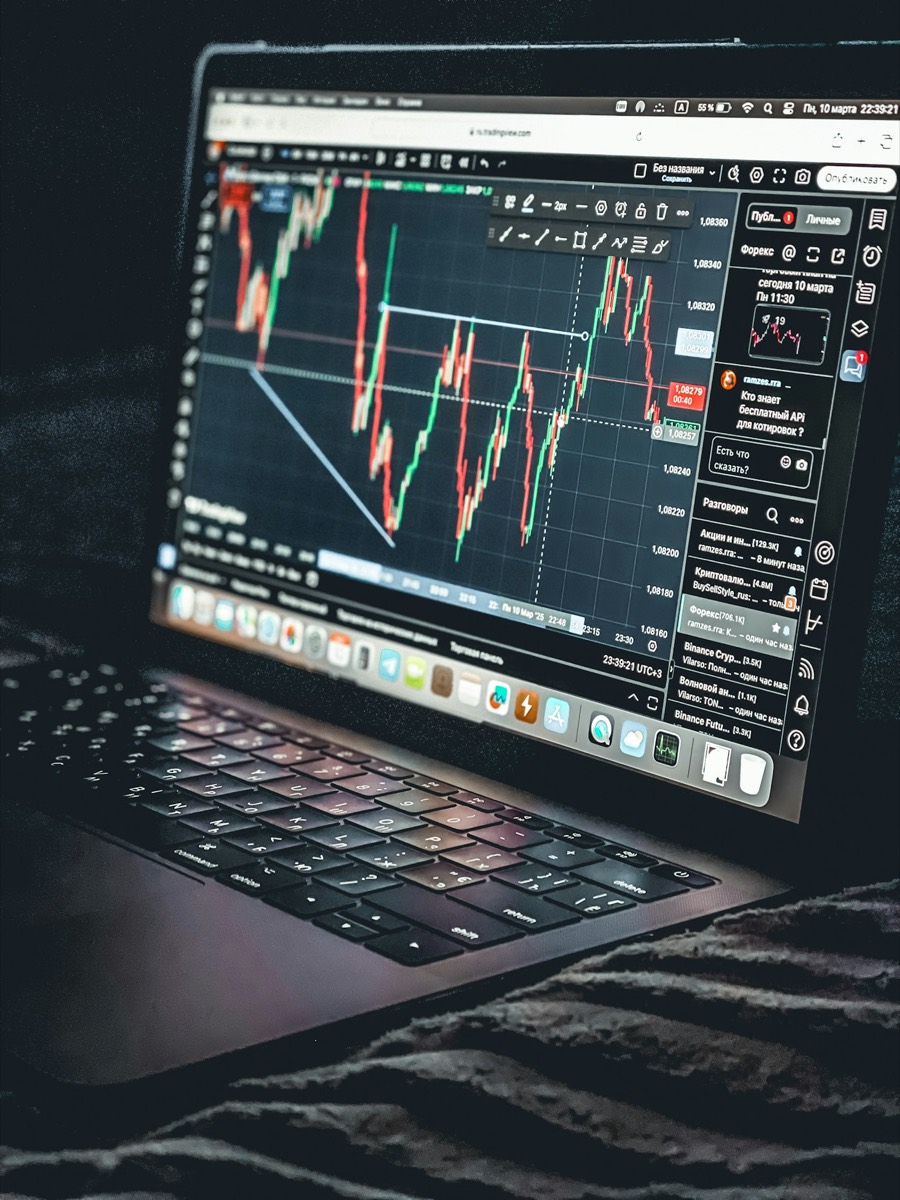 Laptop displaying a stock trading chart